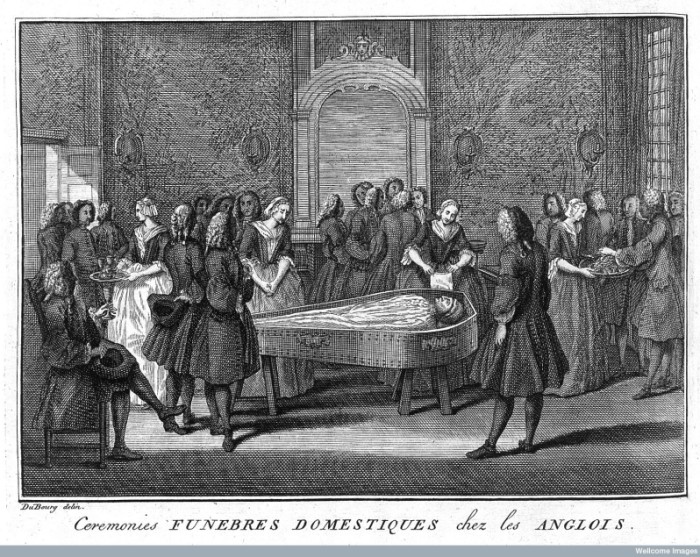 Even though this picture is quite a bit earlier than the other sources we've been looking at, I think its very interesting to see the girl serving wine on the left (and the text mentions that those present will drink several glasses before and after the funeral) and the girl on the right who has a plate of food. Could it be biscuits?                                                                                                                          Funeral Scene from The ceremonies and religious customs of the known world by Bernard Picart, 1737. Credit: Wellcome Library, London. Wellcome Images [CC BY 4.0]Bernard Picart, 1737. Credit: Wellcome Library, London. Wellcome Images http://wellcomeimages.org  CC BY 4.0 http://creativecommons.org/licenses/by/4.0/
